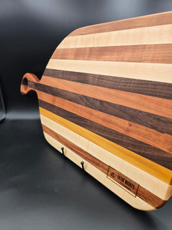 wooden charcuterie board made with cherry maple walnut and yellow heart hardwoods