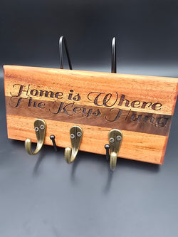 Wooden Key Holder with Home is Where the Keys Hang laser engraved made of mahogany and walnut with bronze hooks made by lathe nights woodworking