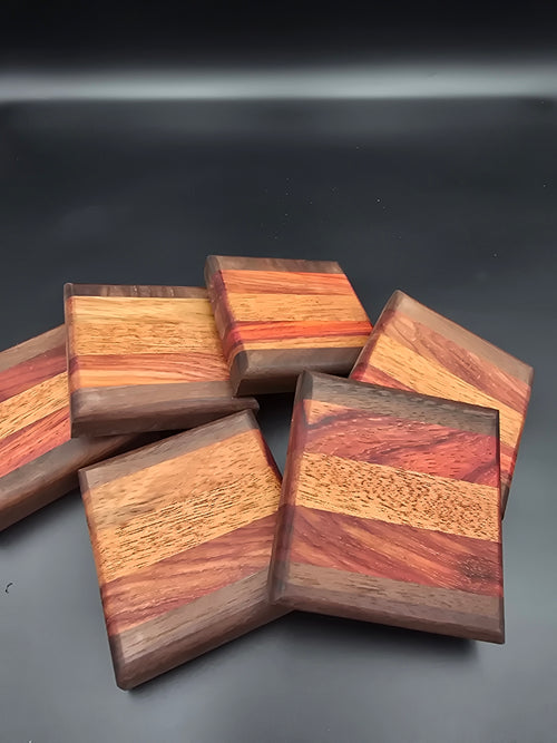 Wooden coasters made of walnut mahogany and padauk by lathe nights woodworking