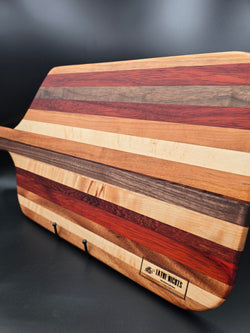Wooden Charcuterie Board made with 7 different hardwoods made by lathe nights woodworking