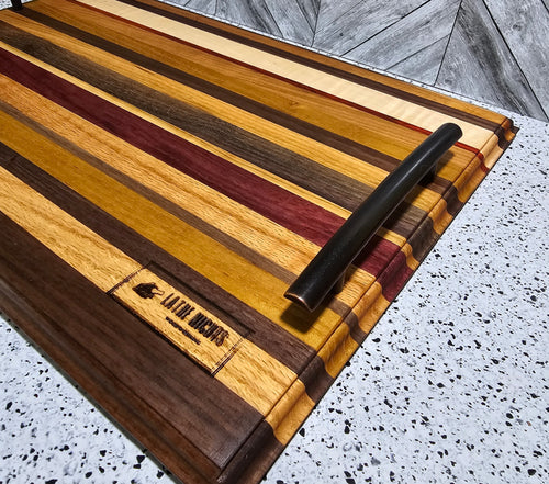 handcrafted edge grain serving tray made from a variety of hardwoods, featuring sleek bronze handles