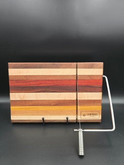 hand crafted wooden cheese board made from walnut, maple, red heart, bolivian rosewood, mahogany, cherry, and yellow heart, built in silver cheese slicing handle perfect for cheese, charcuterie, and appetizers.