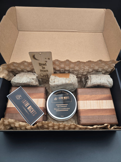 Fall Cabin Gift Box packed with 4 wooden coasters,, one container of all natural wood conditioner, three eco-friendly fire starters, and a laser engraved bookmark