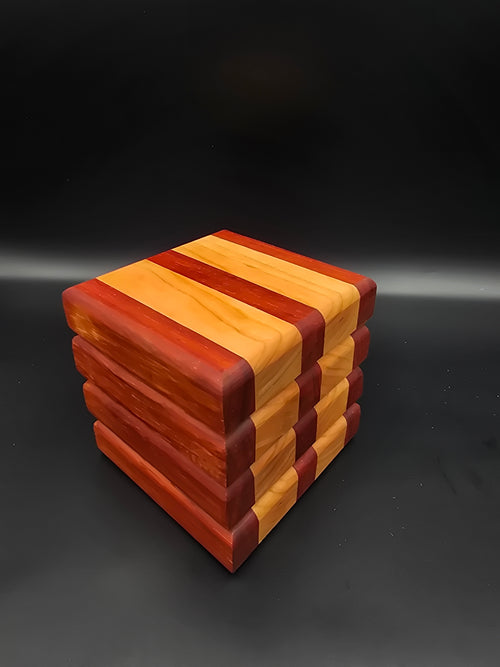 Set of 4 square wooden coasters, made using padauk and cherry natural hardwoods. Features non-slip rubber feet