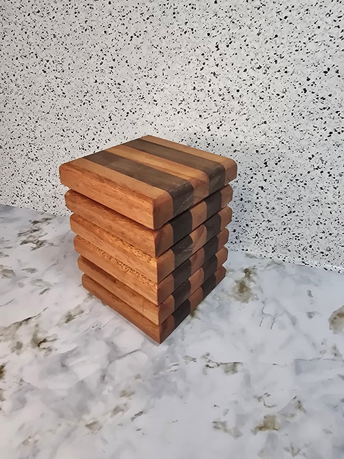 A 6-piece set of handcrafted wooden coasters made from mahogany and walnut hardwoods