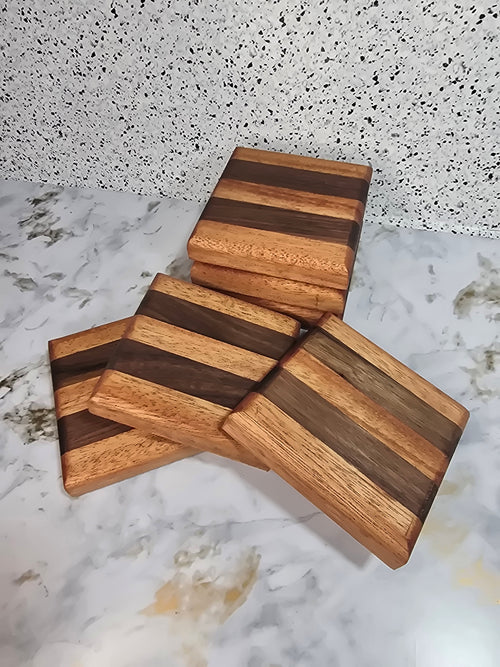 A 6-piece set of handcrafted wooden coasters made from mahogany and walnut hardwoods